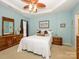 A spacious main bedroom features a tray ceiling, ceiling fan, and carpet at 120 Snead Rd, Fort Mill, SC 29715