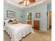 A spacious main bedroom features a tray ceiling, ceiling fan, and access to the ensuite bathroom at 120 Snead Rd, Fort Mill, SC 29715