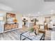 Bright, open-concept living room with modern decor flowing into kitchen and dining areas at 125 Mountain Bridge Way, Statesville, NC 28625