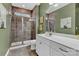 Modern bathroom featuring double sinks, vanity, and tiled walk-in shower at 1284 Independence St, Tega Cay, SC 29708
