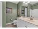 This full bathroom features an oval mirror, tile flooring, and a shower and bath combo at 1284 Independence St, Tega Cay, SC 29708