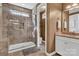 This full bathroom features tile flooring, granite counters, and a glass walk-in shower at 1284 Independence St, Tega Cay, SC 29708