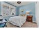 Bright bedroom with natural light, a cozy bed, and neutral decor at 1284 Independence St, Tega Cay, SC 29708