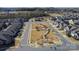 Aerial view of a neighborhood green space and homes with a swimming pool in the background at 1284 Independence St, Tega Cay, SC 29708