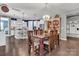 Open dining room featuring a chandelier, wood table, and a view into the kitchen at 1284 Independence St, Tega Cay, SC 29708