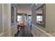 Hallway view showcasing hardwood floors and wall trim at 1284 Independence St, Tega Cay, SC 29708