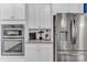 Kitchen features stainless appliances, white cabinets, and granite countertops at 1284 Independence St, Tega Cay, SC 29708