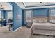 This bedroom boasts blue walls, tray ceilings, and large windows at 1284 Independence St, Tega Cay, SC 29708