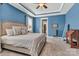 This primary bedroom features blue walls, a decorative ceiling, and large windows at 1284 Independence St, Tega Cay, SC 29708