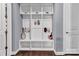 A white mudroom features a bench and cubbies at 1284 Independence St, Tega Cay, SC 29708