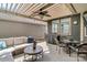 Charming covered patio offers a comfortable seating area and outdoor dining space at 1284 Independence St, Tega Cay, SC 29708