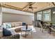 Covered patio with comfortable seating, ceiling fan, grill, and outdoor dining set at 1284 Independence St, Tega Cay, SC 29708