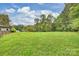 Expansive backyard with lush green grass offering plenty of space for recreation and relaxation at 13019 Westmoreland Farm Rd, Davidson, NC 28036