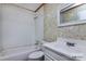 This bathroom is complete with a shower/tub combo, toilet, and sink with cabinet at 132 Kennedy Ave, Kannapolis, NC 28083