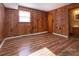 This bedroom is complete with hardwood flooring and a door leading to a bathroom at 132 Kennedy Ave, Kannapolis, NC 28083