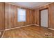This bedroom is complete with hardwood flooring and one window for natural light at 132 Kennedy Ave, Kannapolis, NC 28083