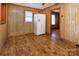 Practical kitchen showcasing wood cabinets, adjacent dining area, and easy-to-clean flooring at 132 Kennedy Ave, Kannapolis, NC 28083