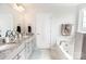 Elegant bathroom with double vanity, granite countertop, soaking tub, and tiled floor at 137 Tenth Green Ct, Statesville, NC 28677