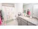 Bright bathroom featuring a granite countertop, and a fun, colorful shower curtain at 137 Tenth Green Ct, Statesville, NC 28677