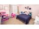 Bright bedroom with pink wall, one window and toys at 137 Tenth Green Ct, Statesville, NC 28677