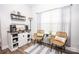 Cozy coffee station featuring decorative shelving, a stylish cabinet, and comfortable seating at 137 Tenth Green Ct, Statesville, NC 28677