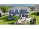 Spacious backyard with a patio, fire pit, dining area, and well maintained landscaping at 137 Tenth Green Ct, Statesville, NC 28677