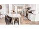 Bright kitchen with stainless steel appliances, granite countertops, and an eat-in breakfast bar at 137 Tenth Green Ct, Statesville, NC 28677
