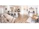 Bright open kitchen featuring a granite island, stainless steel appliances, and pendant lighting at 137 Tenth Green Ct, Statesville, NC 28677