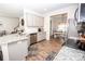 Well-lit kitchen featuring granite countertops, stainless steel appliances, and an open view to the dining area at 137 Tenth Green Ct, Statesville, NC 28677
