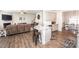 Open kitchen with a large island featuring granite counters and stainless appliances at 137 Tenth Green Ct, Statesville, NC 28677