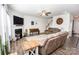 Comfortable living room featuring a fireplace, ceiling fan, and stylish decor at 137 Tenth Green Ct, Statesville, NC 28677