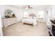 Spacious main bedroom with a fireplace, a ceiling fan, and natural light from the windows at 137 Tenth Green Ct, Statesville, NC 28677