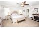 Bright main bedroom with a fireplace, carpet, and large windows at 137 Tenth Green Ct, Statesville, NC 28677