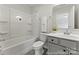 Well-lit bathroom featuring a shower-tub combination, sleek vanity, and modern fixtures at 1503 Autumn Banks Way # 2P, High Shoals, NC 28077