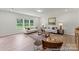 Spacious living room with natural light, hardwood floors, comfortable sofas, and neutral decor at 1503 Autumn Banks Way # 2P, High Shoals, NC 28077