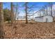 View of the backyard with outbuildings offering space for storage and hobbies at 1691 Hopewell Church Rd, Catawba, NC 28609