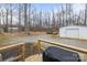 View of the backyard featuring storage sheds and a wood deck overlooking the area at 1691 Hopewell Church Rd, Catawba, NC 28609