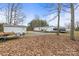Backyard featuring storage buildings, providing ample space for outdoor equipment and storage at 1691 Hopewell Church Rd, Catawba, NC 28609
