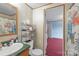 Bathroom with green countertop and sink, toilet, and floral shower curtain at 1691 Hopewell Church Rd, Catawba, NC 28609