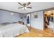 Bedroom with hardwood floors, ceiling fan and doorway to a closet at 1691 Hopewell Church Rd, Catawba, NC 28609