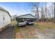 Open carport with gravel drive and parking for two vehicles at 1691 Hopewell Church Rd, Catawba, NC 28609