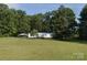 Charming single-story home with lush green lawn and mature trees at 1691 Hopewell Church Rd, Catawba, NC 28609