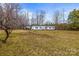 Spacious property featuring a single-story home with a detached carport, offering ample parking at 1691 Hopewell Church Rd, Catawba, NC 28609