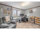 Comfortable home office with bright window, work station and relaxing gray sofa at 1691 Hopewell Church Rd, Catawba, NC 28609