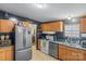 Kitchen with stainless steel refrigerator, dishwasher, and laminate countertops at 1691 Hopewell Church Rd, Catawba, NC 28609