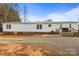 Single-story home with an inviting back deck, perfect for outdoor entertaining and relaxation at 1691 Hopewell Church Rd, Catawba, NC 28609