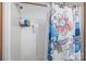 Shower with a colorful curtain and wall-mounted caddy for toiletries at 1691 Hopewell Church Rd, Catawba, NC 28609