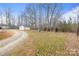 Large yard with mature trees and shed, offering plenty of space for outdoor activities at 1691 Hopewell Church Rd, Catawba, NC 28609