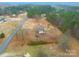 This country home has a spacious yard surrounded by trees at 1912 Beach Ln, Heath Springs, SC 29058