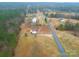 A sprawling home with a wooden deck sits on a large lot at 1912 Beach Ln, Heath Springs, SC 29058